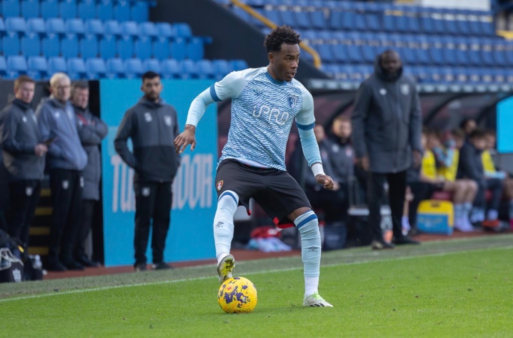 Footballer in action on the pitch