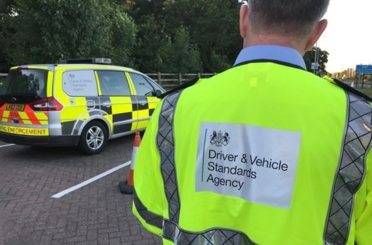 DVSA roadside checkpoint with a traffic enforcement vehicle and officer