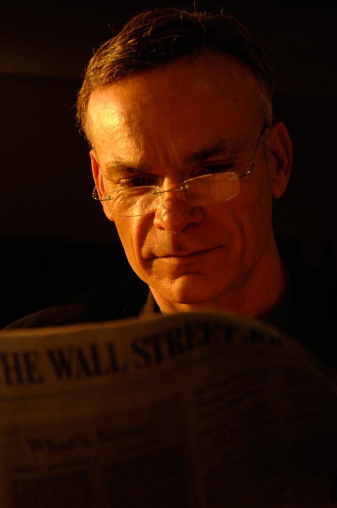 Executive reading Wall Street Journal