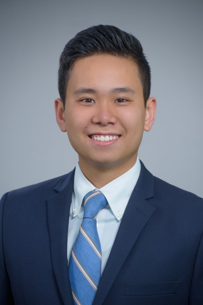 Professional headshot grey background