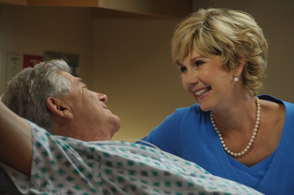Caregiver with patient in hospital room
