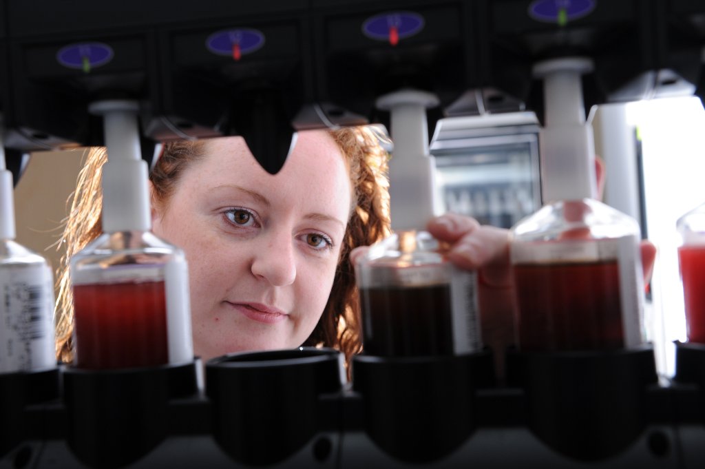Lab technician with blood analysis equipment