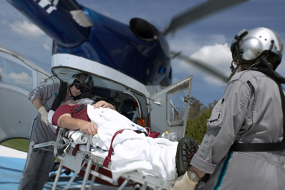 Air medical helicopter crew loading patient