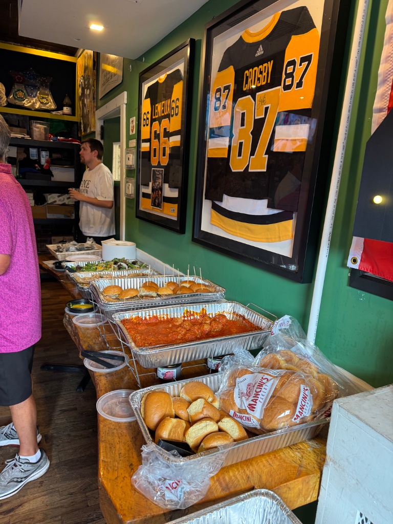 Catered food setup at a Pittsburgh Penguins event by DiRenzo Brothers Catering