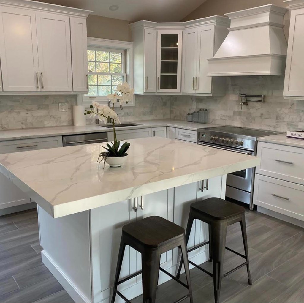 White Kitchen with Quartz Island & Marble Backsplash