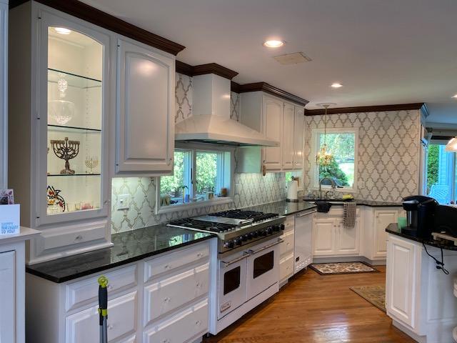 White Kitchen with Mosaic Backsplash & Waterfall Island