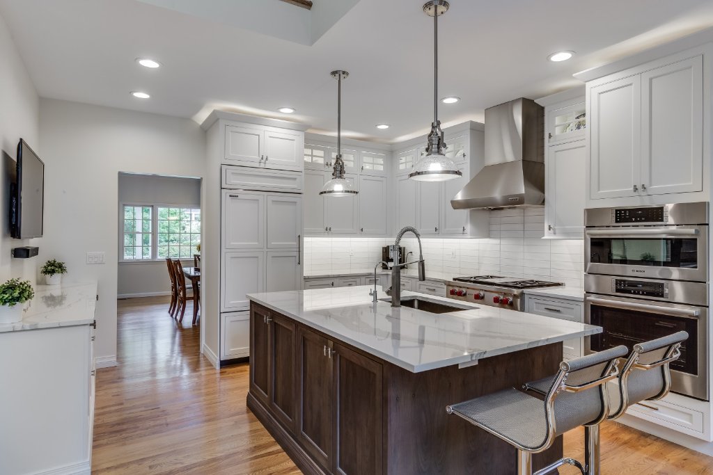 Transitional White Kitchen with Walnut Island