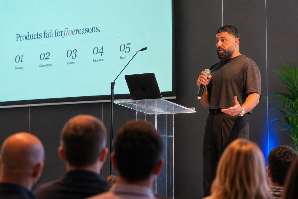 Sas on stage presenting 'Products fail for five reasons'