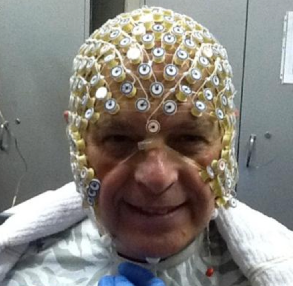 Ron Bonnstetter wearing a multi-electrode EEG cap during cognitive research