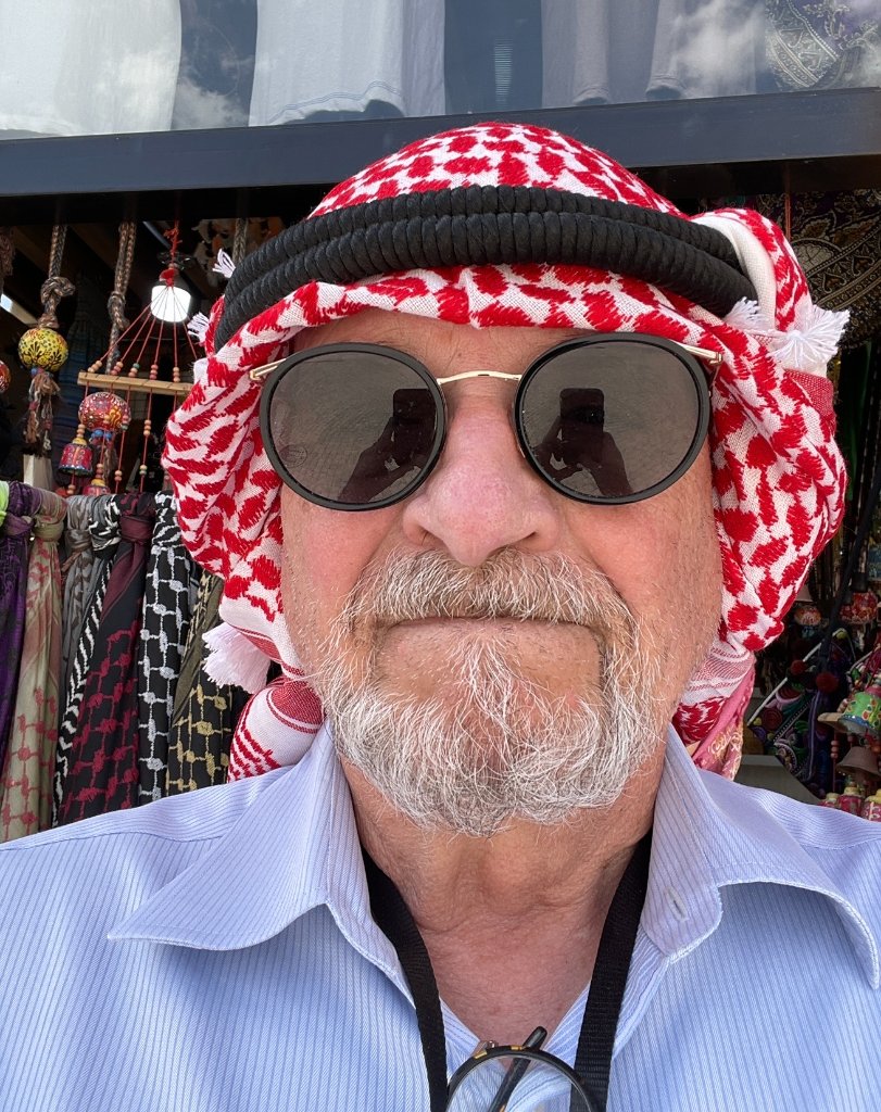 Ron wearing a red-and-white keffiyeh headscarf during his travels in Egypt
