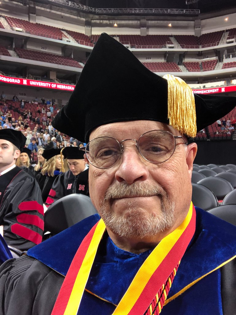 Ron Bonnstetter in graduation regalia at a University of Nebraska commencement