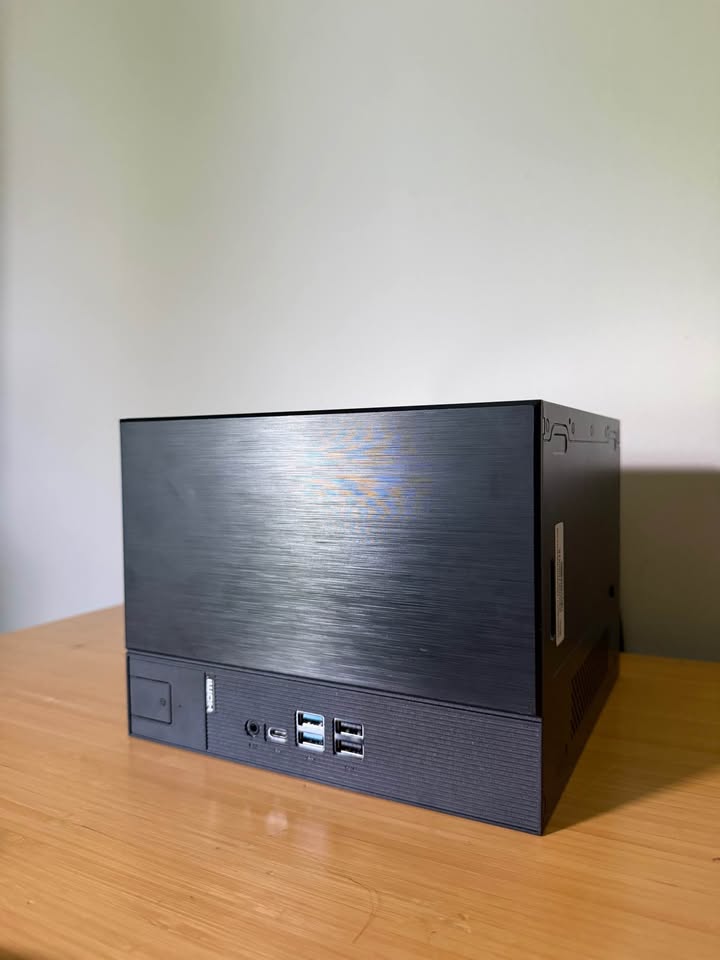 Enlin's compact black SteamOS gaming PC with a brushed front panel