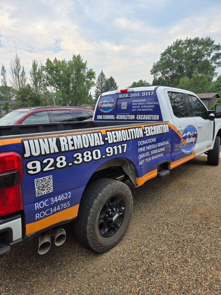 FlagHauling LLC branded truck wrap — junk removal, demolition, excavation