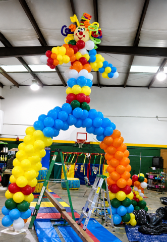Colorful balloon arch gym setup