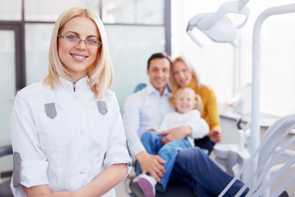 Dentist with family patient
