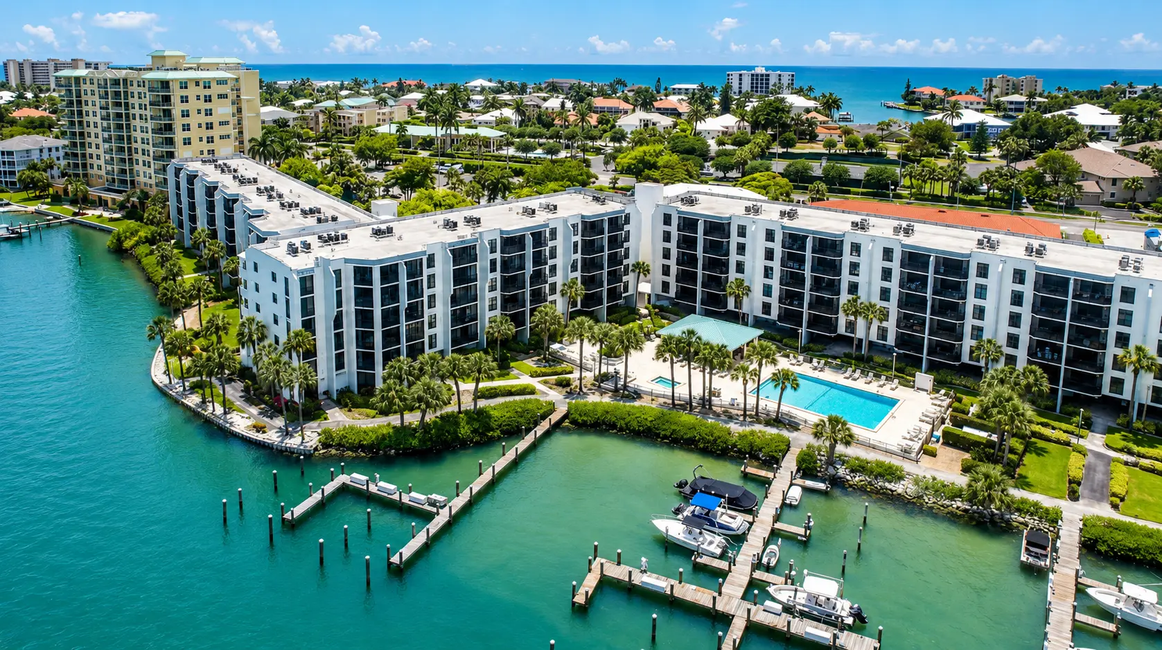 Riverside Club waterfront community pool and marina aerial view Marco Island Florida