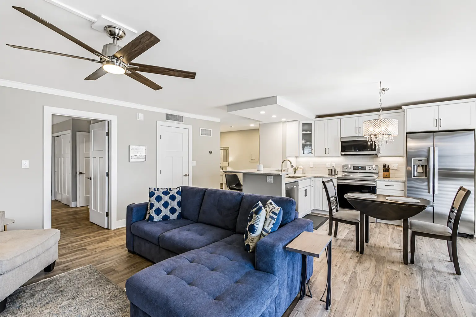 Living room and open kitchen at Bottlenose Pointe Marco Island luxury vacation rental