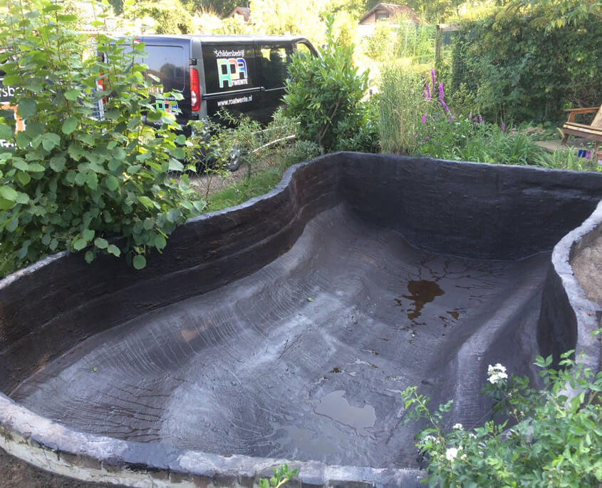 Liquid-applied seamless waterproofing membrane applied to shaped concrete containment structure — flexible waterproof coating conforming to complex curves and angles in civil engineering environment