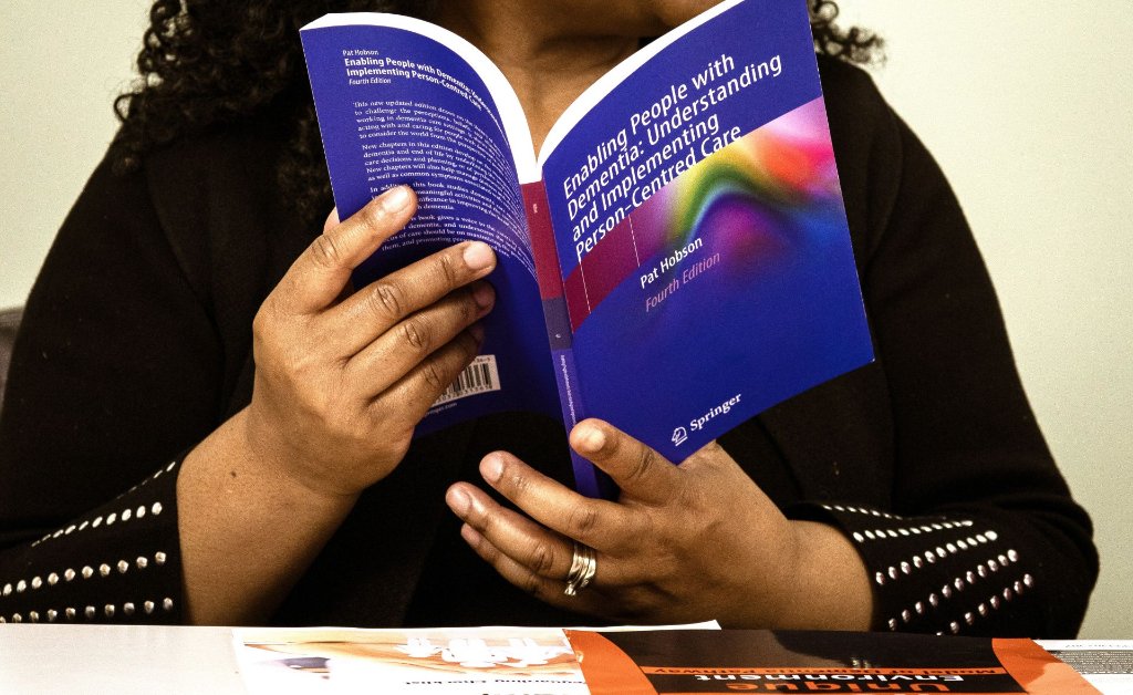 Close-up of Pat Hobson's dementia care book open during reading