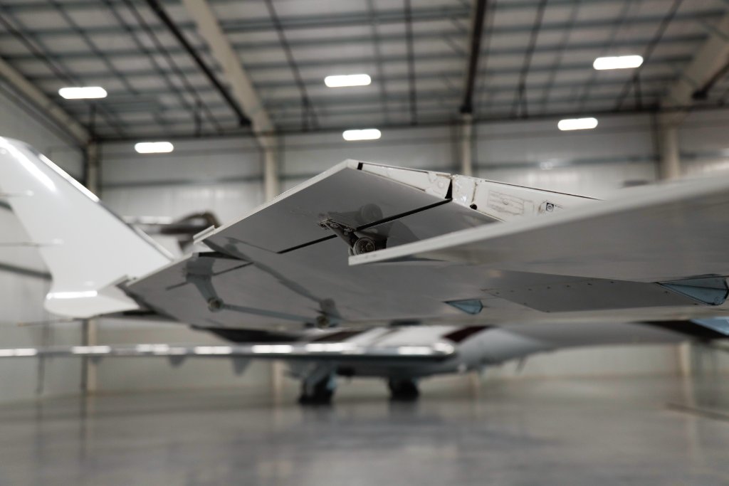 Aircraft wing detail in hangar