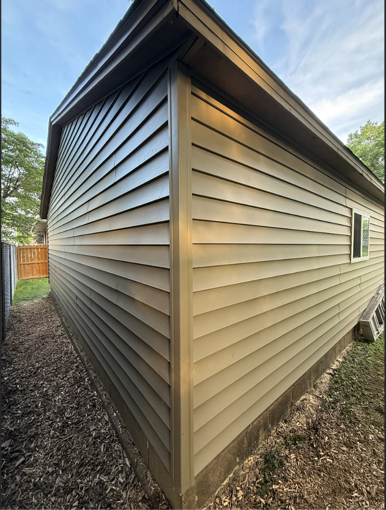 Completed dark siding residential project with deck