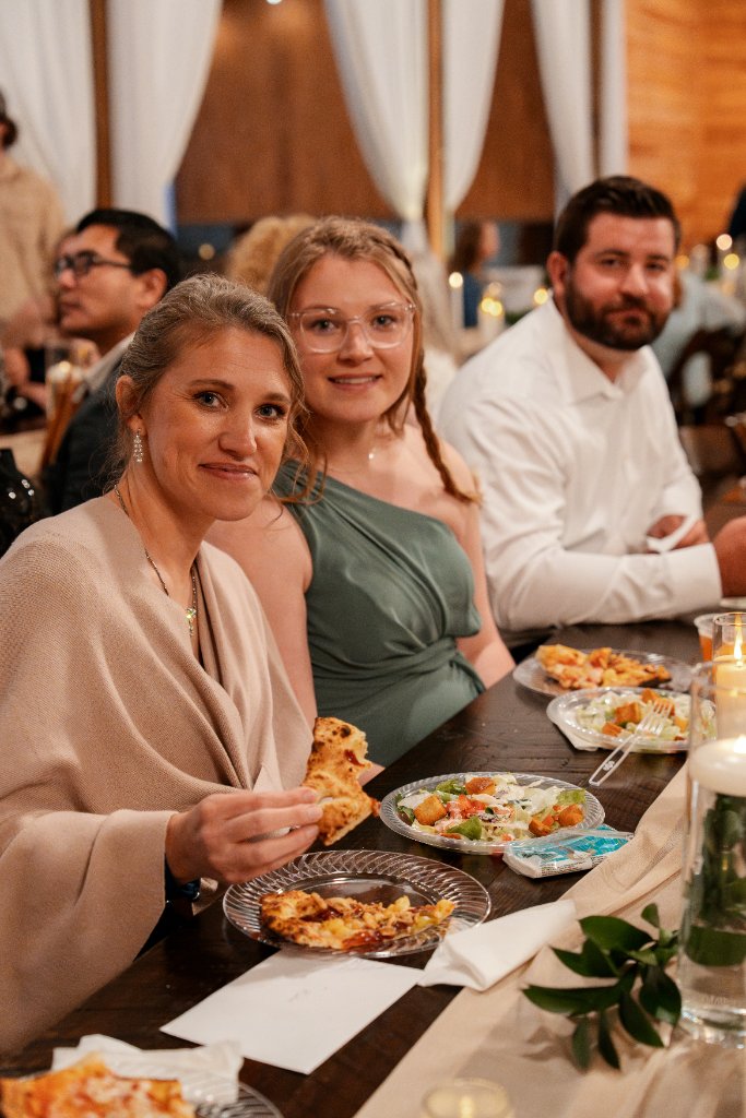 Wedding guests enjoying pizza
