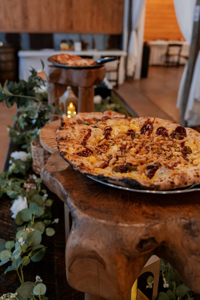Elegant pizza display on rustic wood stands
