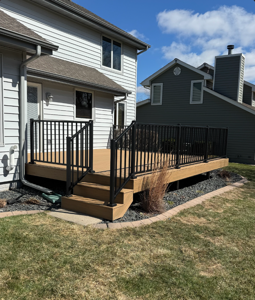 Ground-level composite deck built by Akin Brothers Construction in Central Iowa