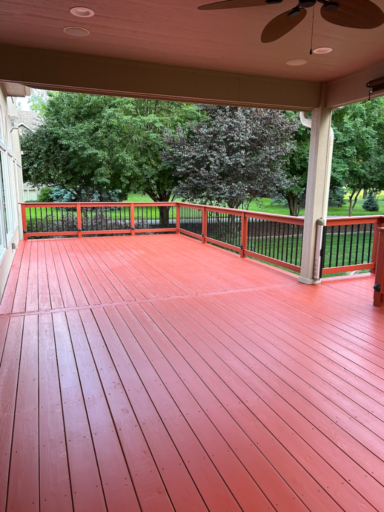 After - Deck surface with uniform Sherwin-Williams SuperDeck solid stain finish refinished by Akin Brothers Construction