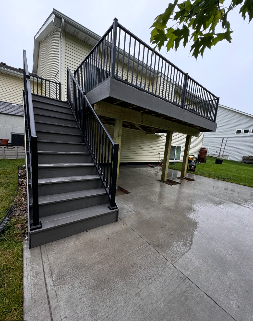 Elevated deck with staircase built by deck builder Akin Brothers Construction in Ankeny, Iowa