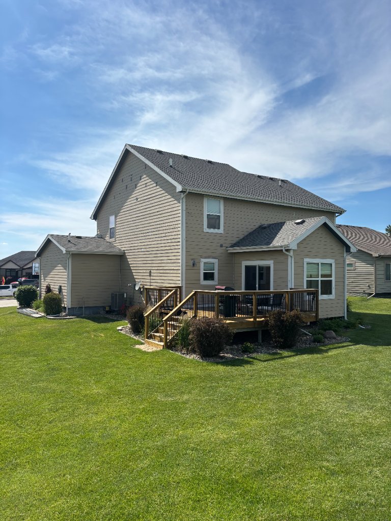 After - Rear of home with new LP SmartSide siding and deck