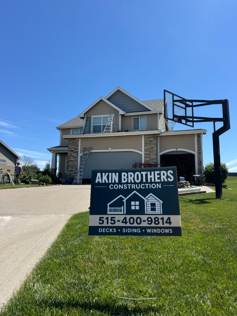 After - Front of home with Akin Brothers sign during installation