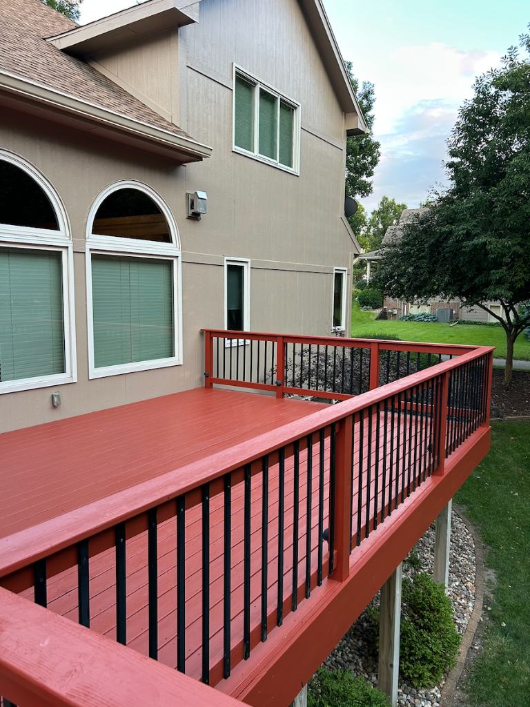 After - Exterior deck view from the yard after staining and refinishing by Akin Brothers deck builders in Central Iowa