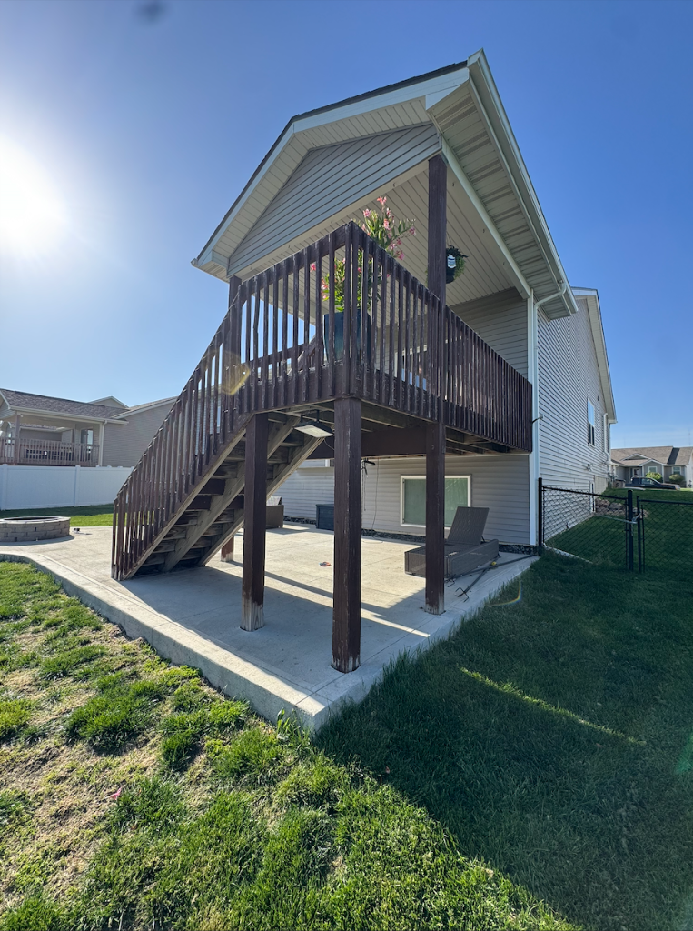 Before - Old wood deck structure viewed from the backyard, before composite deck replacement by Akin Brothers deck builders in North Ankeny