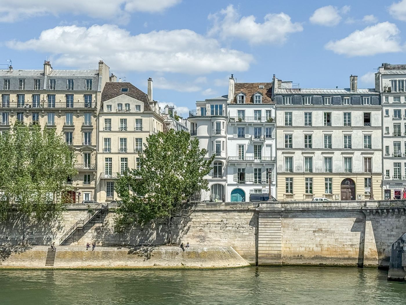 The building facades of Quai d’Orléans seen from across the Seine