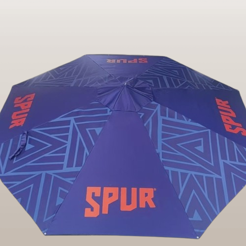 Fully Branded Solaris umbrella with custom SPUR logo and geometric pattern