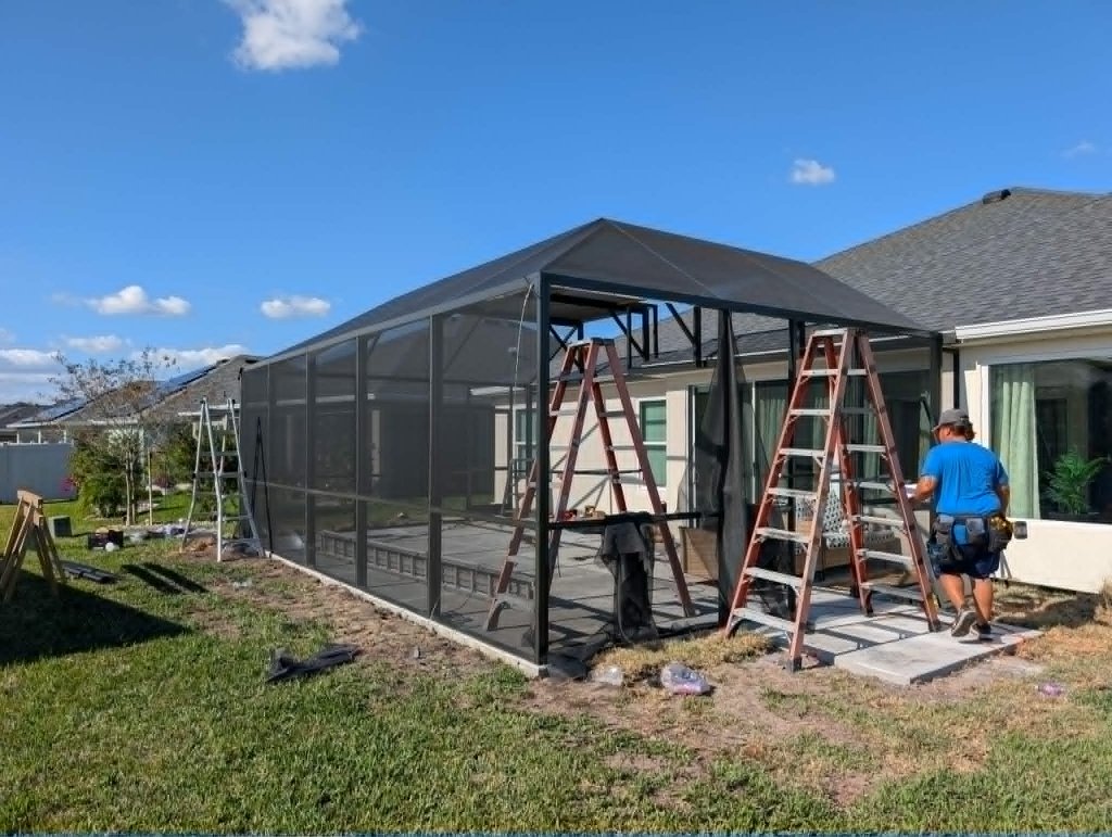 Screen enclosure installation in progress — licensed Florida contractor