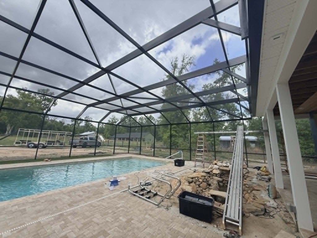 Pool cage interior view — pool enclosure installation Florida