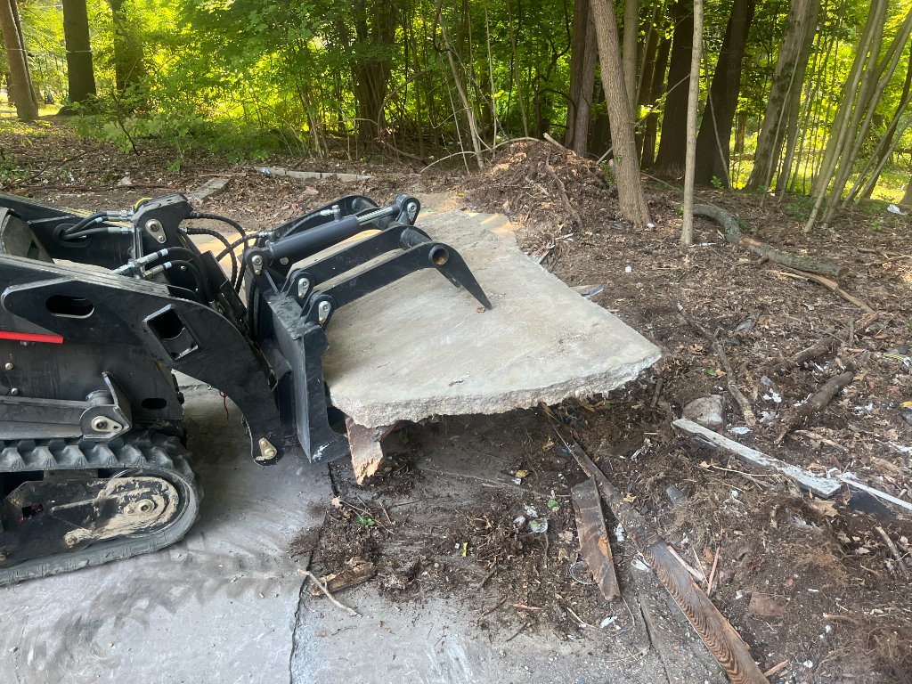 Mini skid steer moving heavy materials
