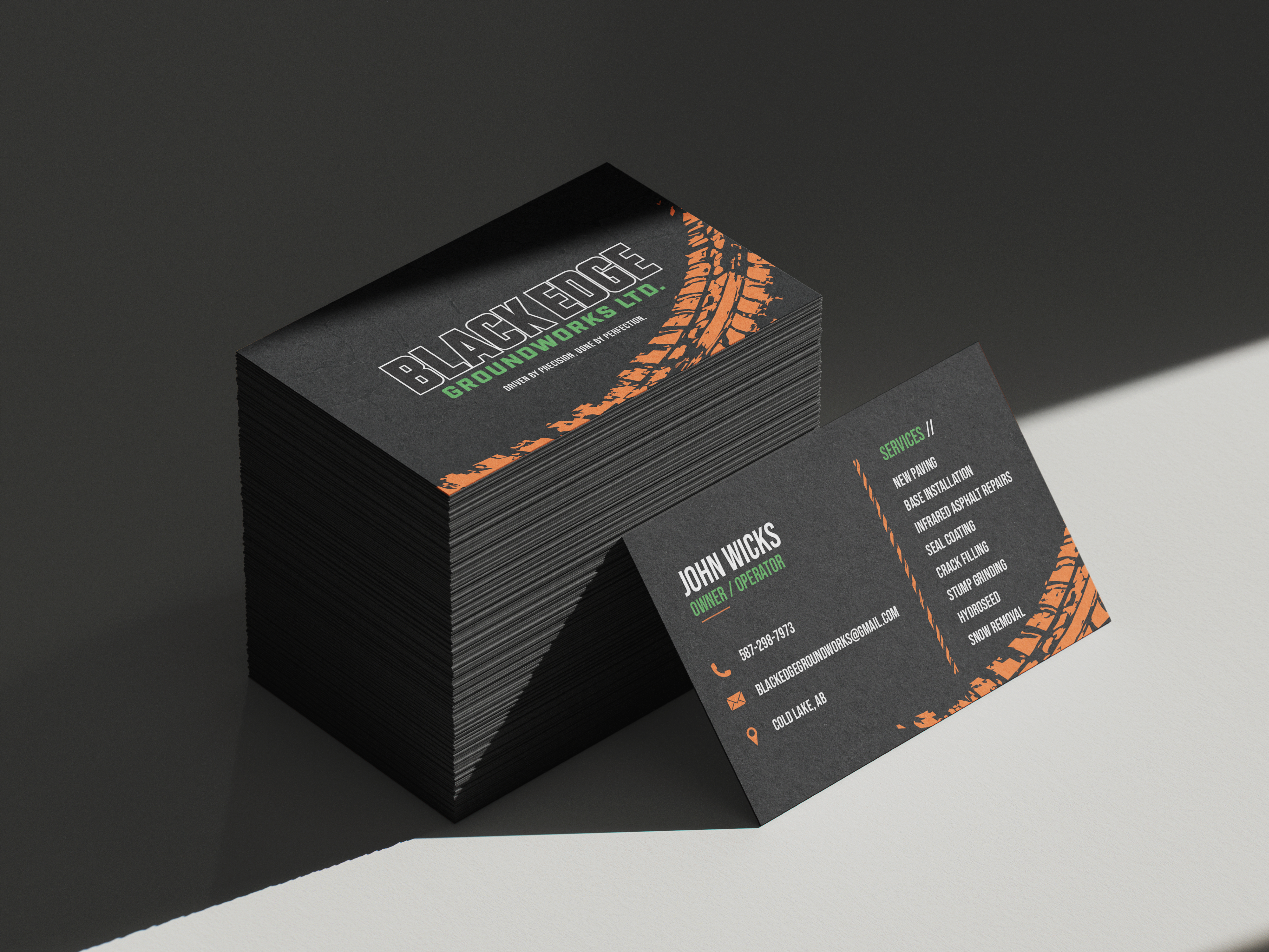 Black Edge Groundworks business card mockup showing front and back design