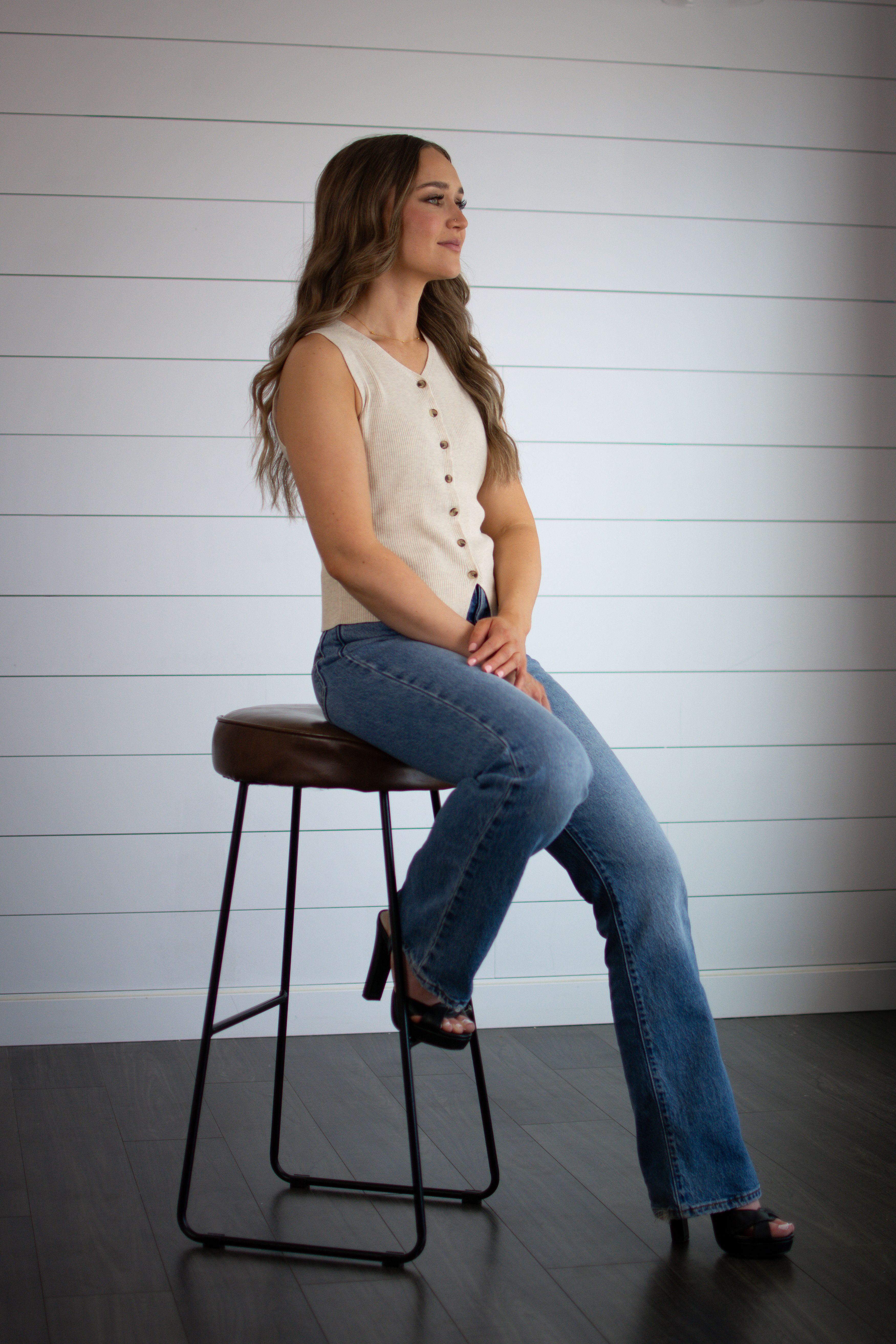 Star Remedy   portrait in cream chair with pampas and plants