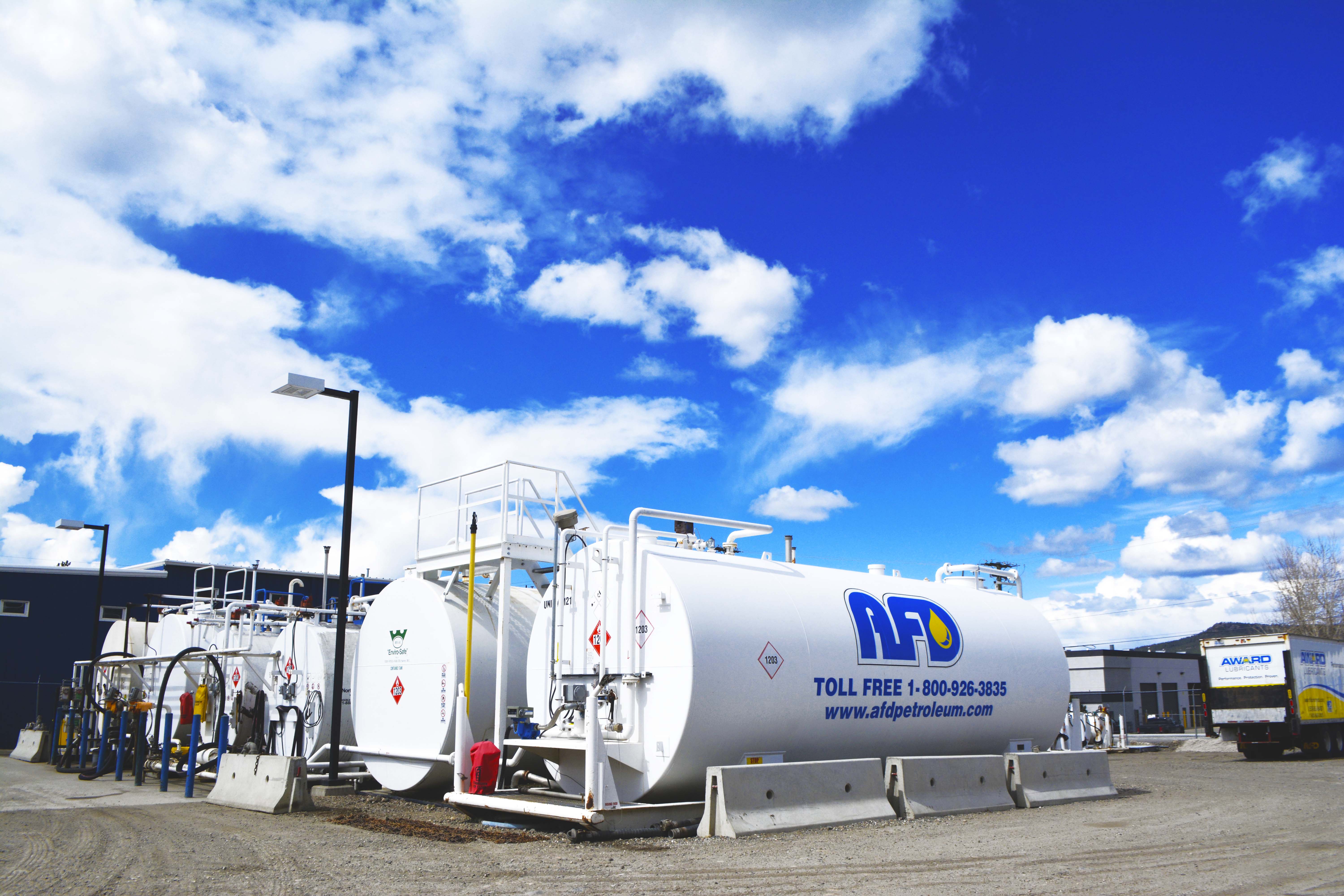 Row of white AFD Petroleum fuel storage tanks at the Kelowna yard