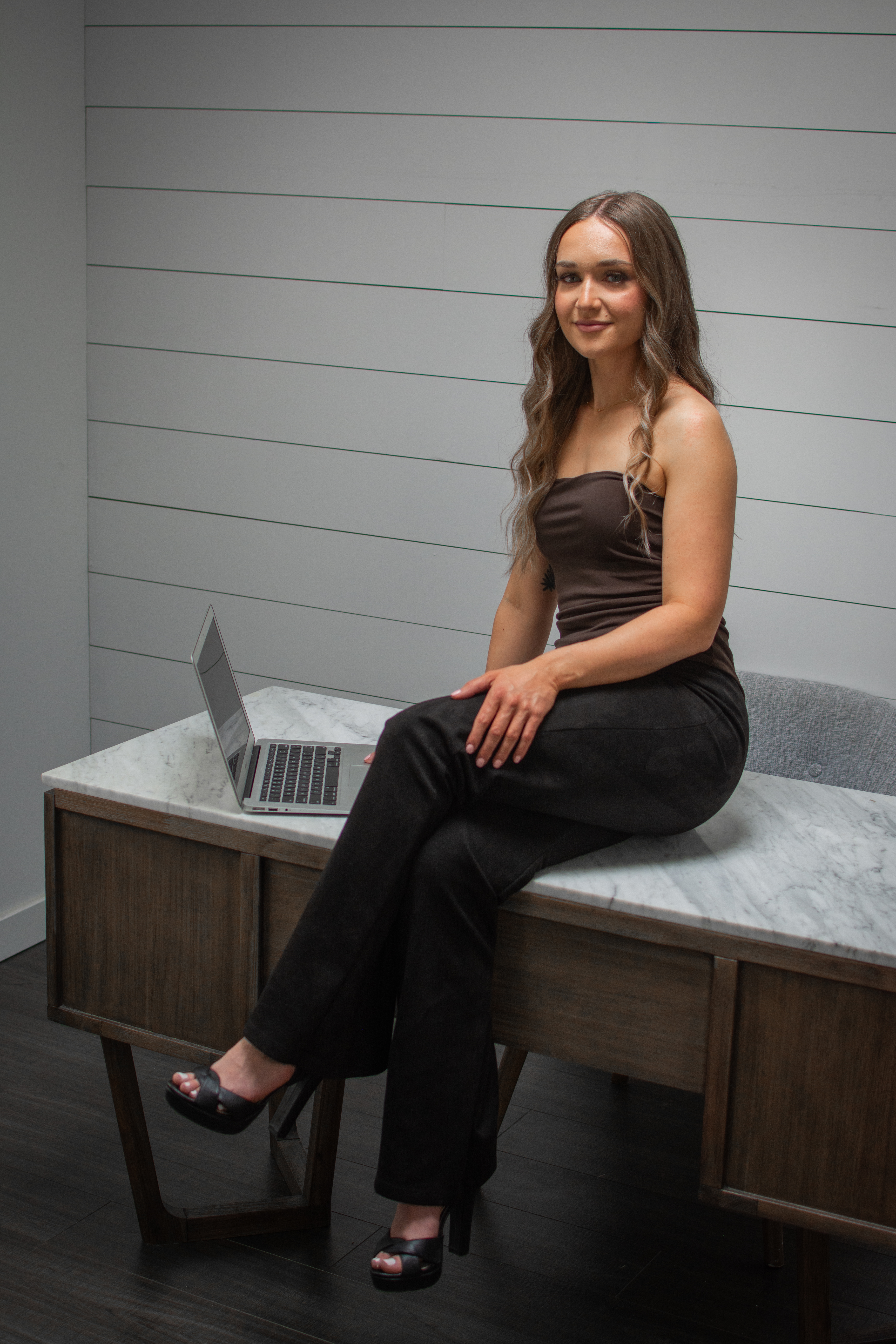 Star Remedy   full-body seated portrait on marble counter