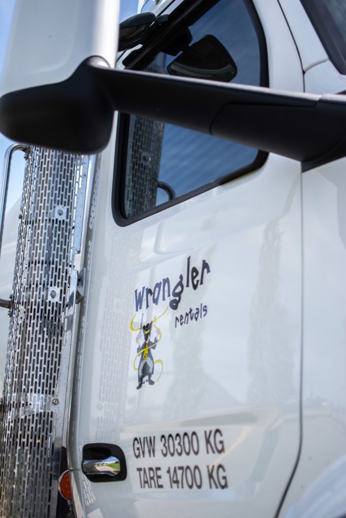 Close-up of Wrangler Rentals logo on passenger-side truck door