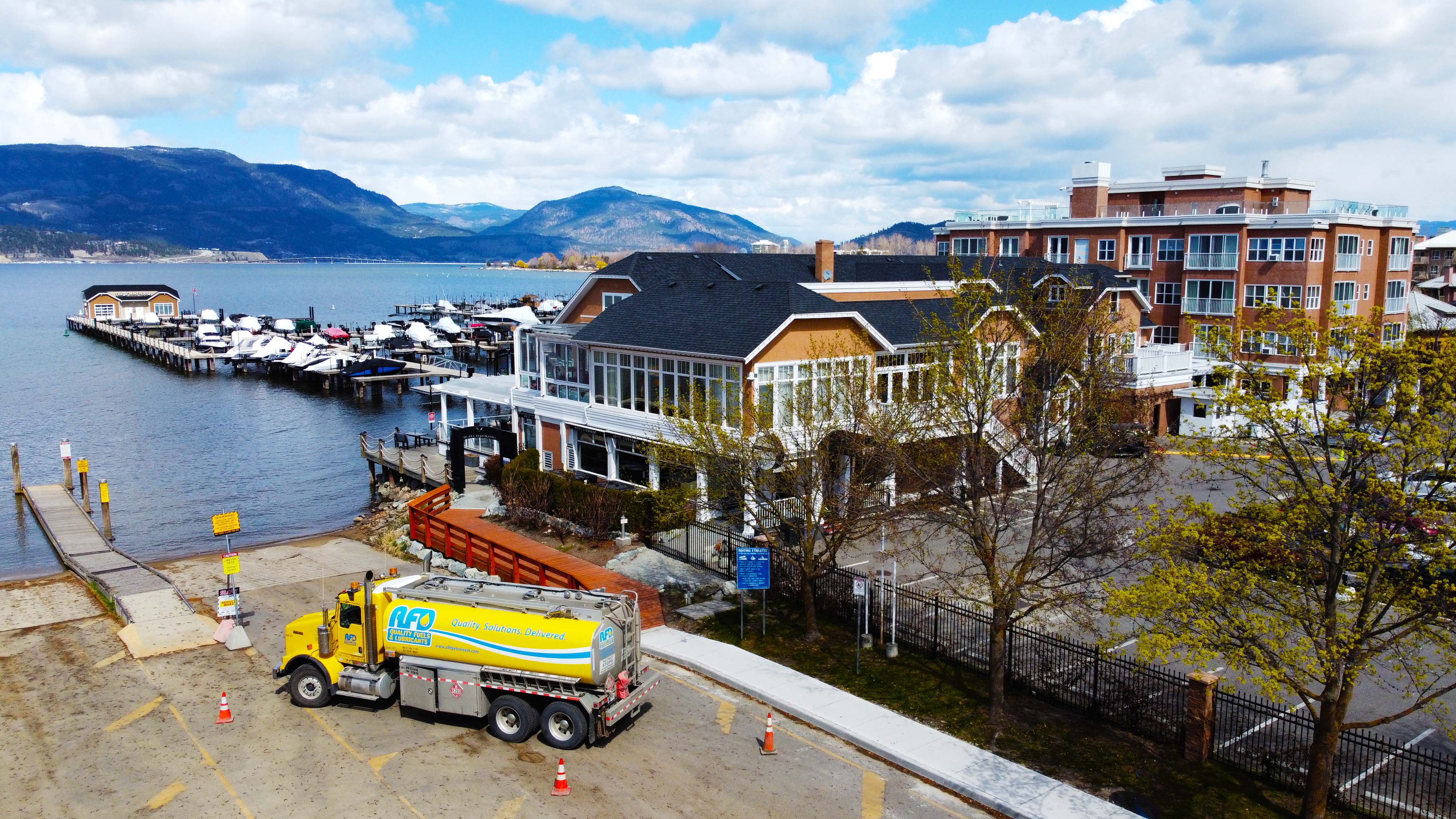 Aerial drone view of the AFD Petroleum Kelowna site with the fuel truck, marina and lake