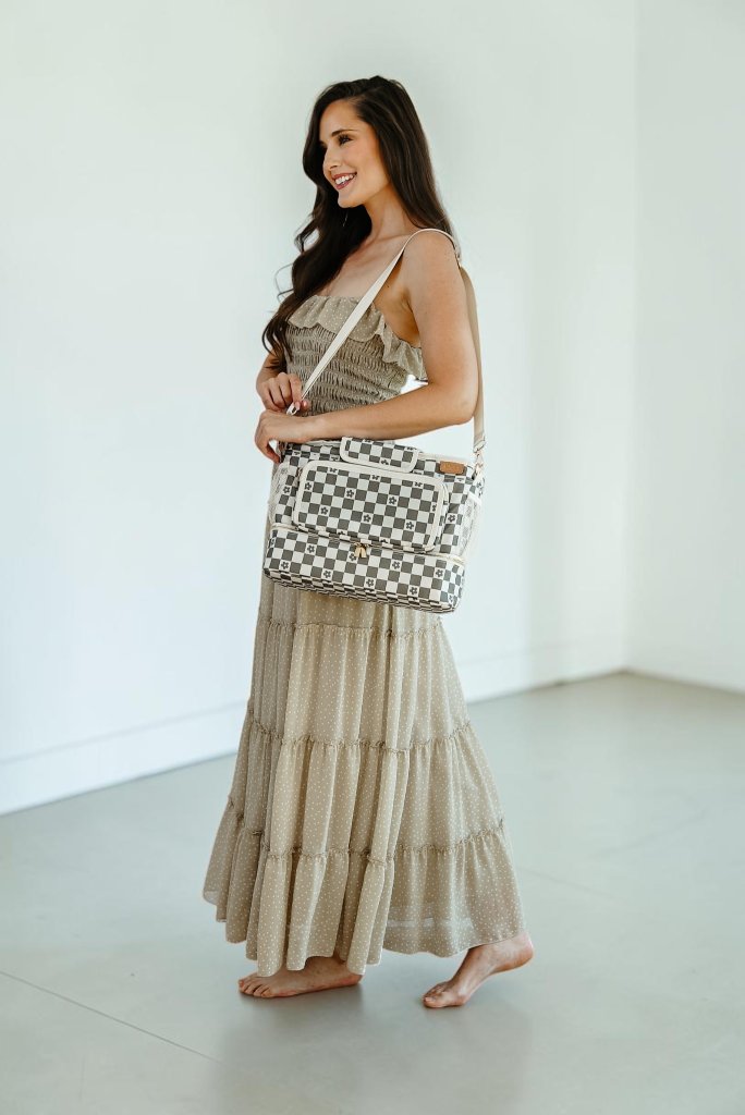 Model wearing JOONI daisy checker bag as crossbody in maxi dress