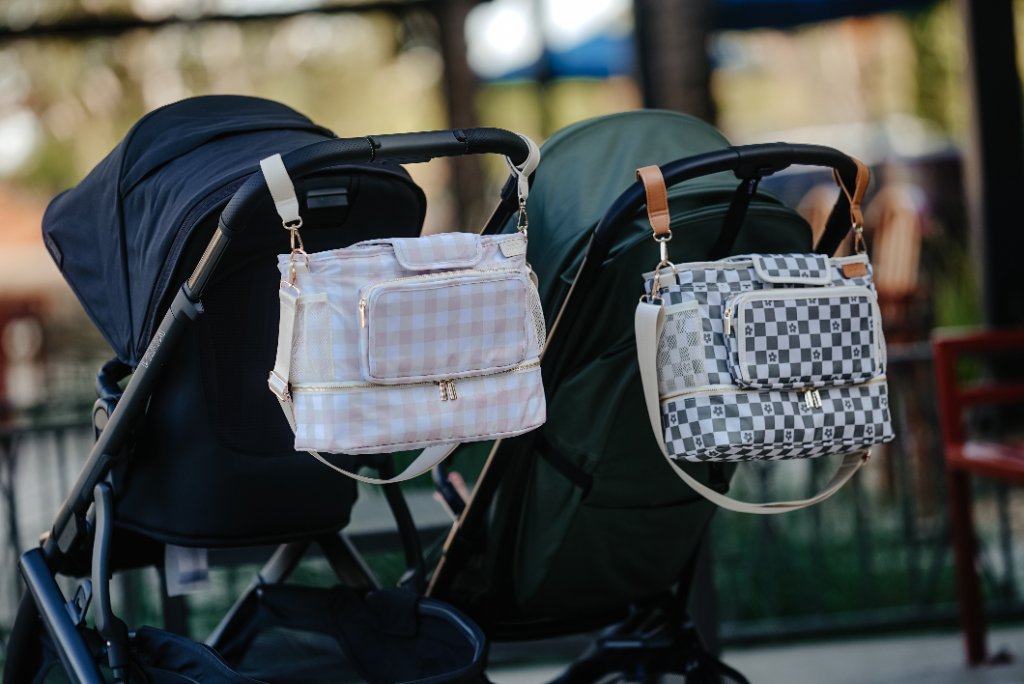 JOONI bag transitioning from stroller to parent's arm in a minimalist entryway