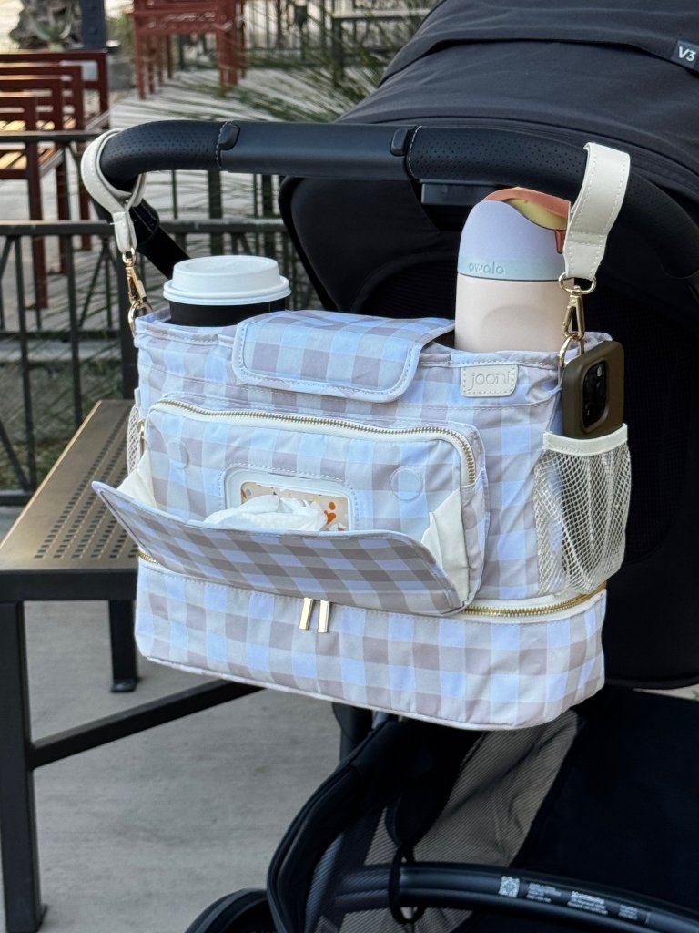 JOONI stroller caddy attached to stroller handlebar, editorial lifestyle shot