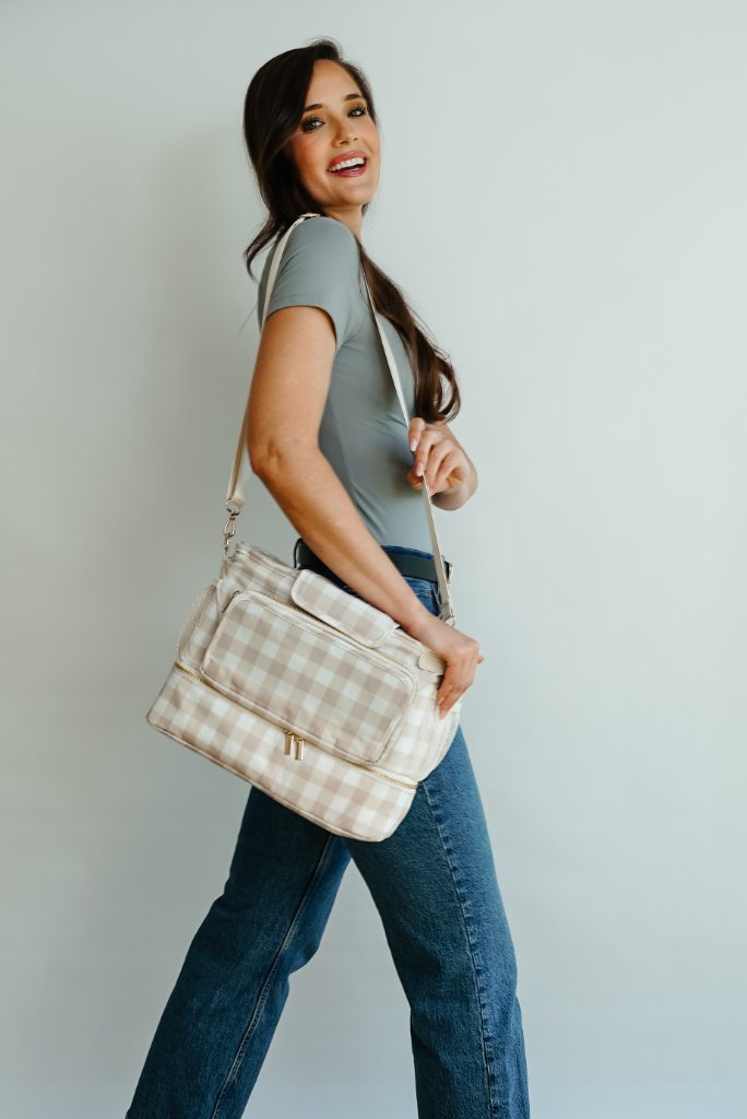 JOONI blush gingham bag carried over shoulder