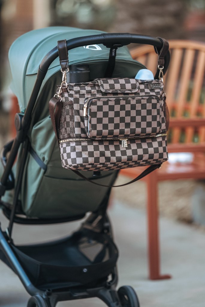 JOONI bag clipped to Bugaboo stroller handlebar outdoors